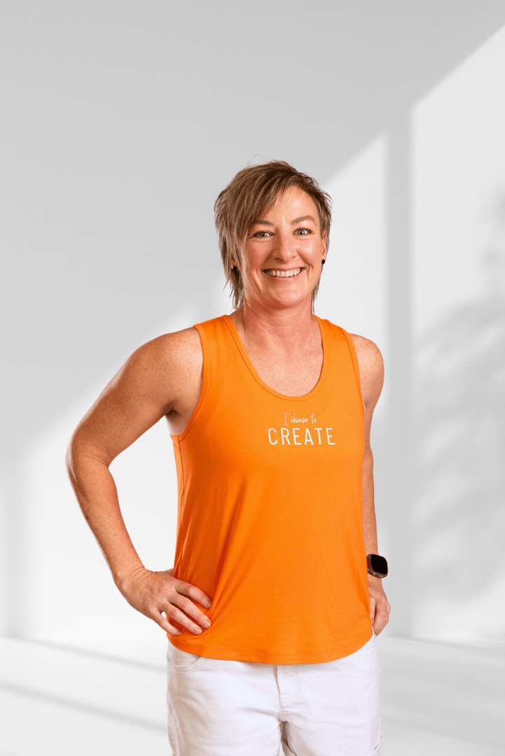 Create | Orange sleeveless activewear top for women - Empowered Clothing - stride