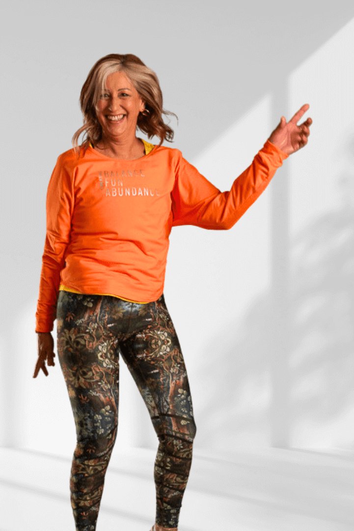 Creating | Orange long sleeve activewear top for women - Empowered Clothing - stride