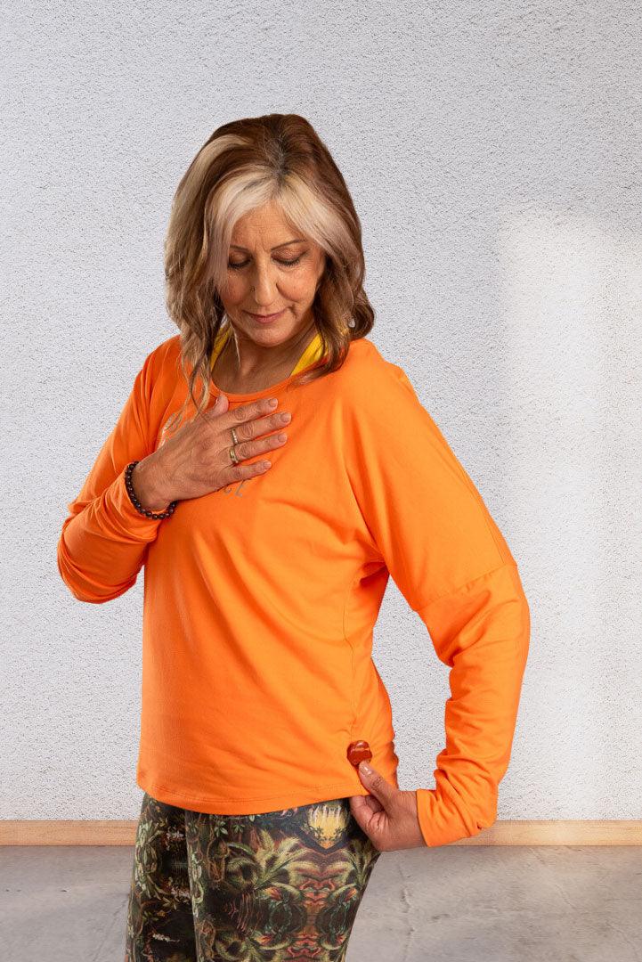 Creating | Orange long sleeve activewear top for women - Empowered Clothing - stride