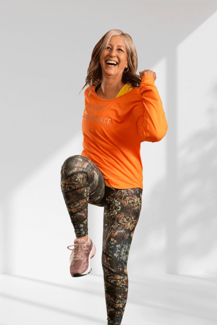 Creating | Orange long sleeve activewear top for women - Empowered Clothing - stride