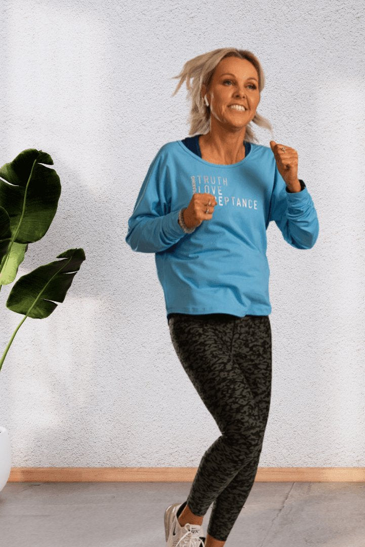 Speaking | Pale blue long sleeve activewear top - Empowered Clothing - stride